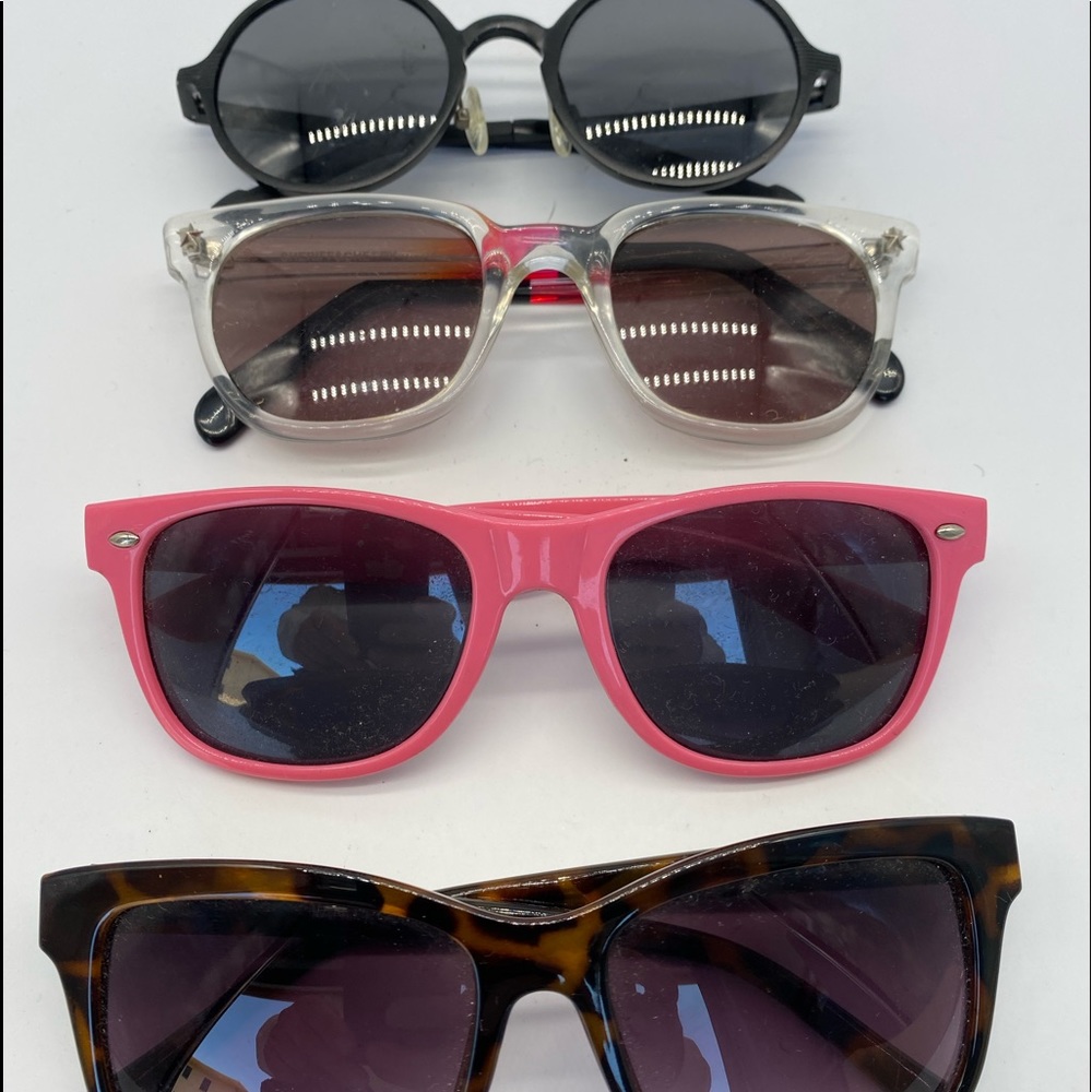 4 pair of unbranded sunglasses $40